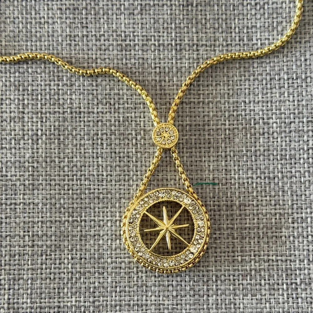 Gold Tone Compass Starburst Pendant Necklace with Crystal Halo